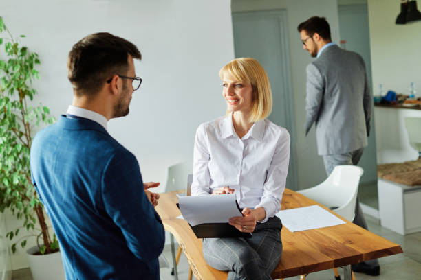 istock young business people meeting office teamwork group success corporate discussion team group desk businesswoman document file planning 2071594670
