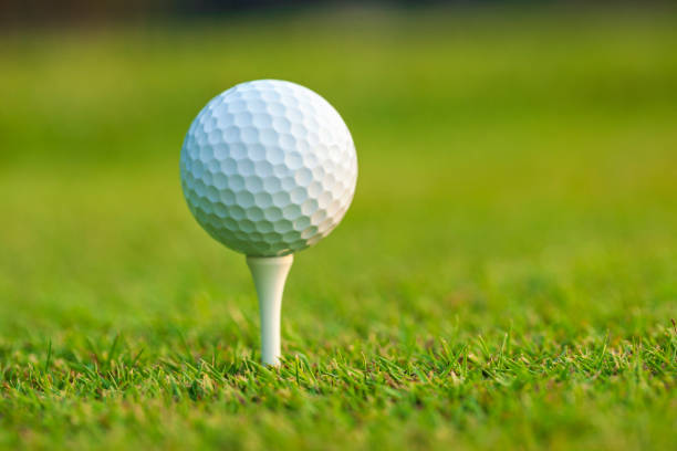 istock Low angle view of a golf ball on a tee in front of defocused background 2071722298
