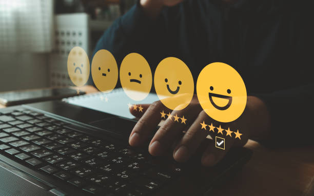 Client's hand ticked the happy face smile face, Customer service evaluation and satisfaction survey concept. User give rating to service experience on online application for Customer review feedback.