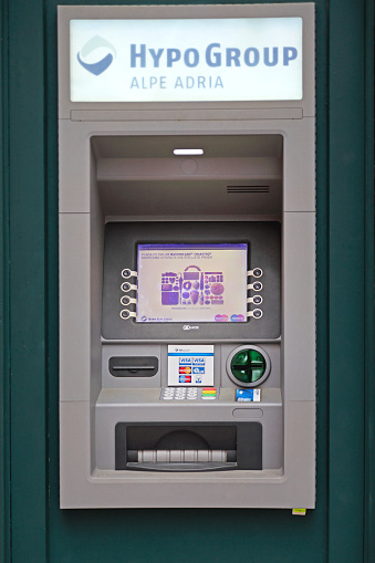 Rovinj, Croatia - October 15, 2014:  Hypo Group Alpe Adria Atm Bank Automated Teller Machine Build in Wall.