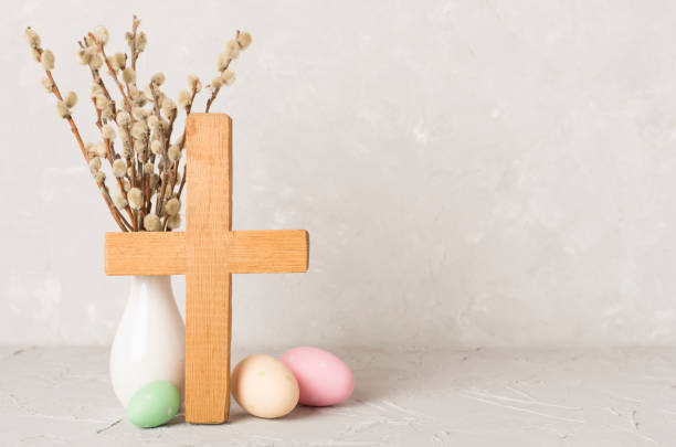 istock Easter eggs with wooden cross on concrete background 2071898883