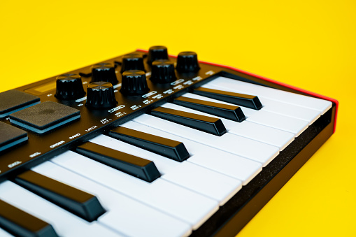 Piano keys on a yellow background