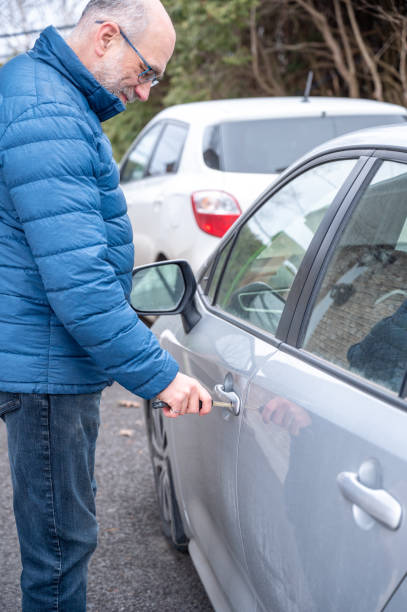 istock Mature man opening car door 2071928282