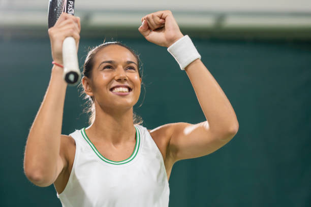 istock Female tennis player showing winner gesture 2071934010