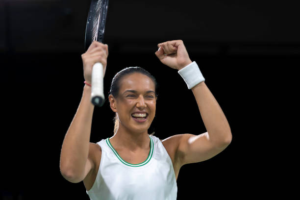 istock Female tennis player showing winner gesture 2071934015