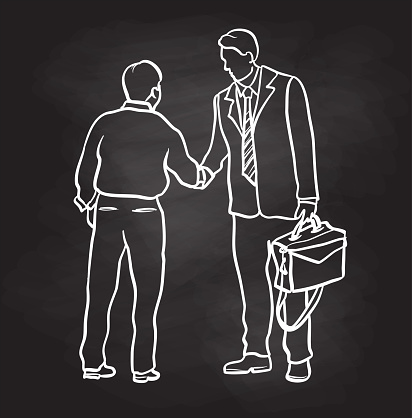 Business people shaking hands.  One is wearing a suit and tie while holding a briefcase and the other just a dress shirt.