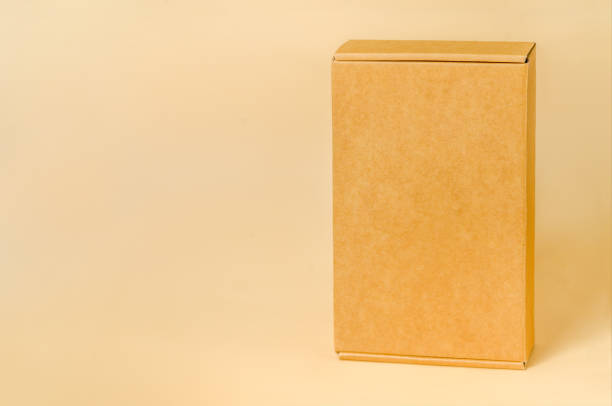 istock Sustainable Packaging Solution: Cardboard Carton Seen from the Side on Neutral Surface 2071937776