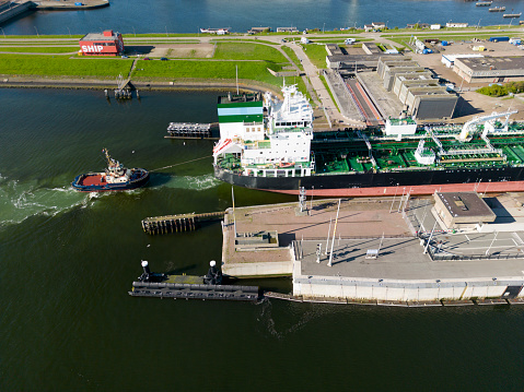 A asd tugboat assisting a bulkcarrier, Ijmuiden, The Netherlands