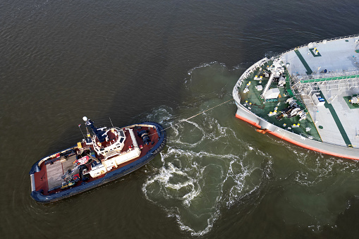 A asd tugboat assisting a bulkcarrier, Ijmuiden, The Netherlands