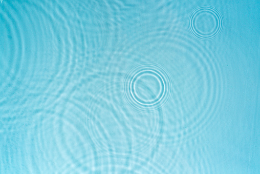 pebble stone in water with ripples background 3D illustration