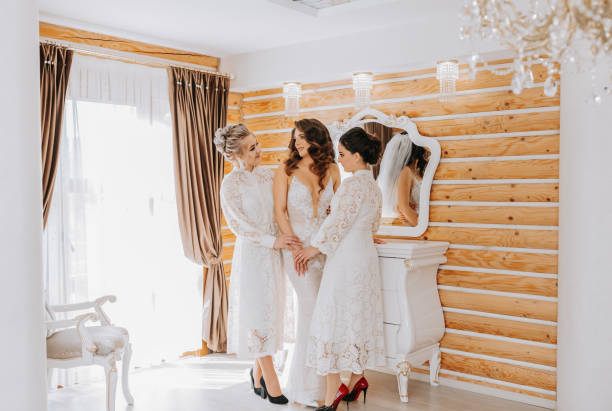 istock girlfriends rejoice with the bride and help prepare for the wedding. 2072062721