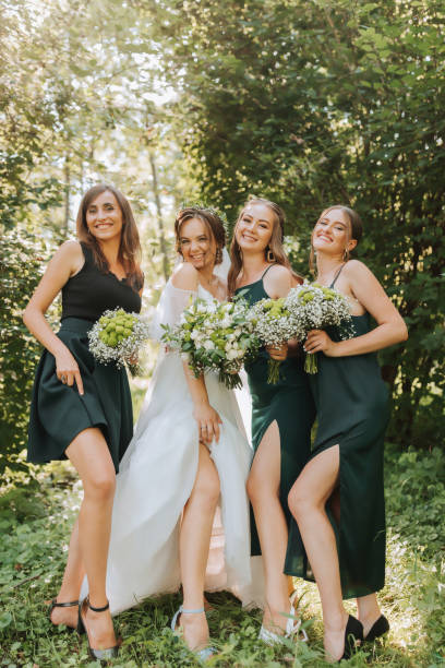 istock A bride celebrates her wedding with friends outdoors after the ceremony 2072069309