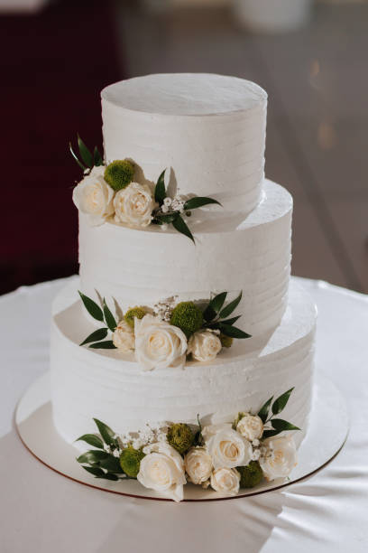 istock decorated wedding cake, in three tiers, decorated with flowers 2072069829