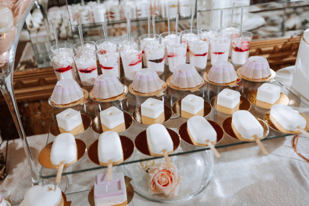 istock Festive dessert table with sweets. Wedding candy bar, various cakes, chocolates on stands. 2072071482