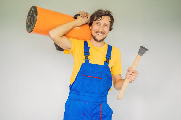 Male foreman for installing stretch ceilings with air heater.
