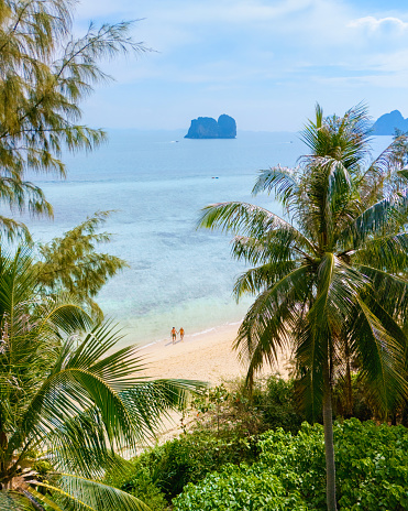 The clear blue sea water with the big rock mountains in the sea at Railay Krabi Thailand .