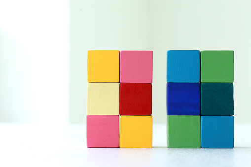 Various combinations of interspersing and stacking blocks of various colors