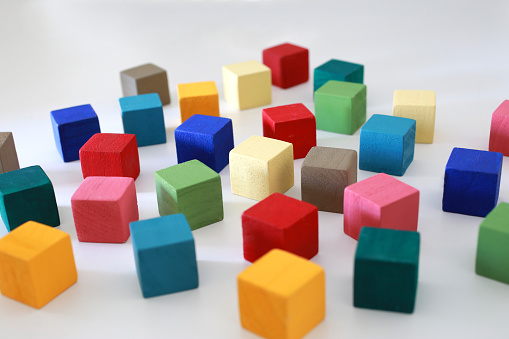 Various combinations of interspersing and stacking blocks of various colors