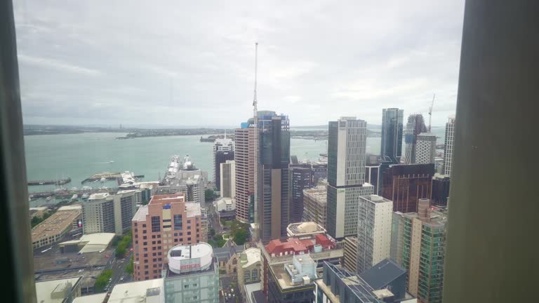 Auckland downtown seen from above, Sky Tower. New Zealand. modern commercial buildings in city center.