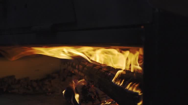 Lighting in the wood oven Warmth and tradition