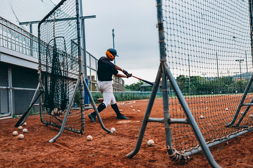 Baseball, pitch and outdoor sports teamwork game with a man team player from Mexico. Pitcher busy with athlete exercise, fitness training and cardio match workout motivation ready for a fast ball