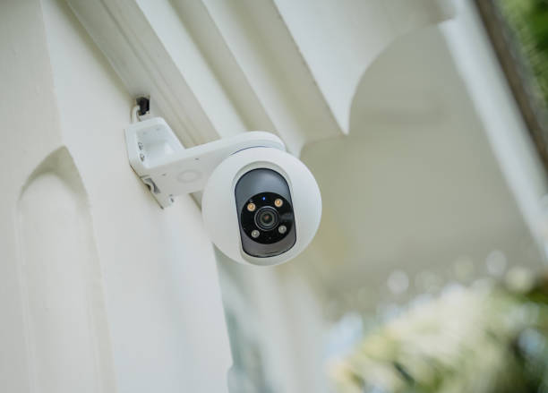 istock Modern CCTV camera on a wall of a residential building 2072382214