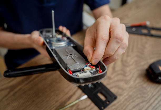 istock A technician assembles and installs smart electronic door lock for house protection 2072402065