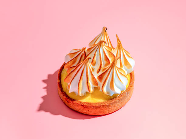 istock Lemon tart with burnt meringue, pink background 2072402597