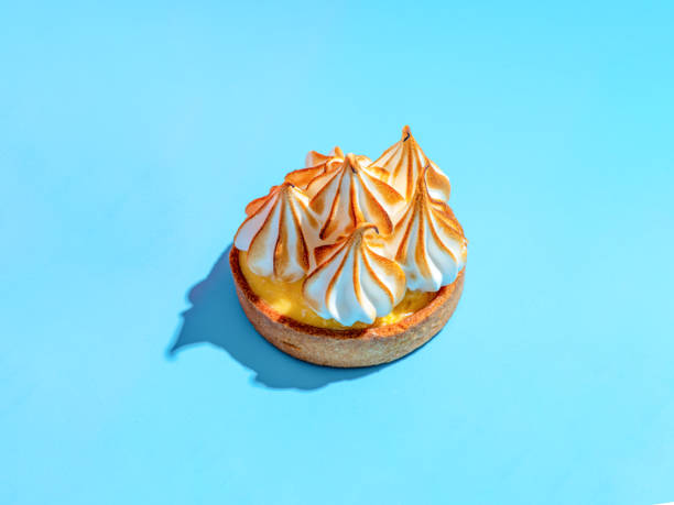 istock Lemon tart with burnt meringue, blue background 2072403633