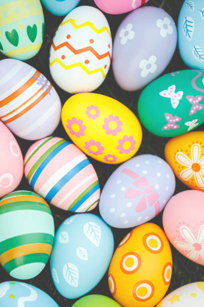 istock Collection of colorful easter eggs on green grass to celebrate Easter or spring. 2072449543