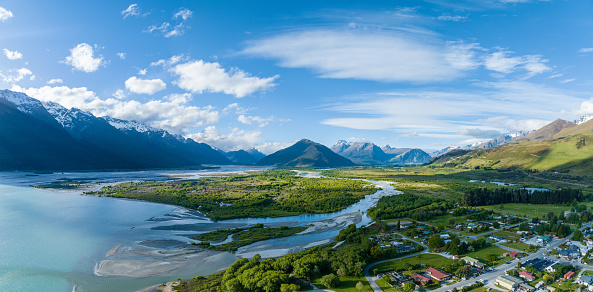 Experience breathtaking vistas from above in at Glenorchy, New Zealand, where mountains meet water in a stunning landscape. Aerial beauty awaits.