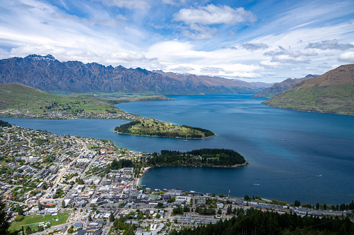 Experience Queenstown's enchanting waterfront, where boats, restaurants, and stunning lakeside views create a picturesque setting in New Zealand.