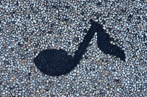 symbol of musical notes on the rock floor