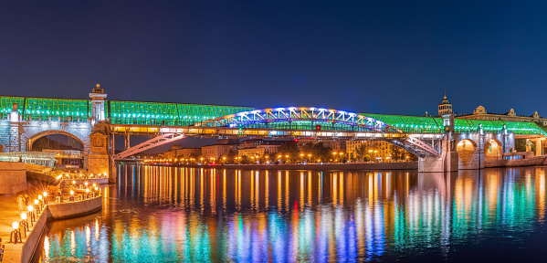 Pushkinskiy bridge with night illumination. Pedestrian bridge with night illumination. Bridge to Gorky Park. Embankment of the Moscow River