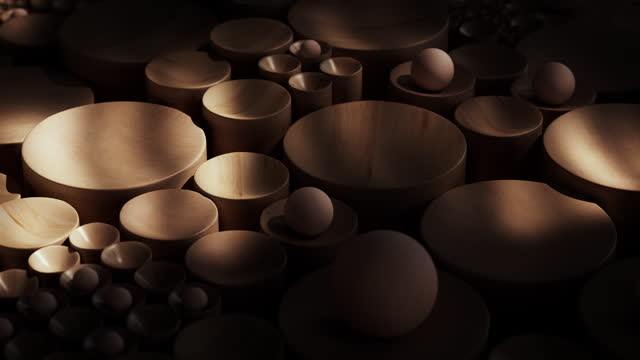An abstract backdrop with wooden spheres and hemispheres arranged.