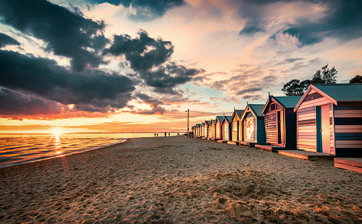 The sunset view of the Brighton Beach and colorful Brighton Bathing Boxes in Melbourne
