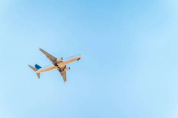 Airplane before landing in blue sky, Boeing 737-800. Air Transport. Tourism and travel concept.