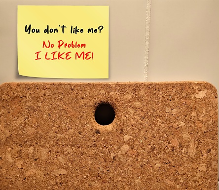 Yellow note on wall with handwritten text YOU DON'T LIKE ME? NO PROBLEM - I LIKE ME  - Self-love concept - affirmation to stop caring what other thinks, work on self-respect and self-worth,  learn how to put yourself first