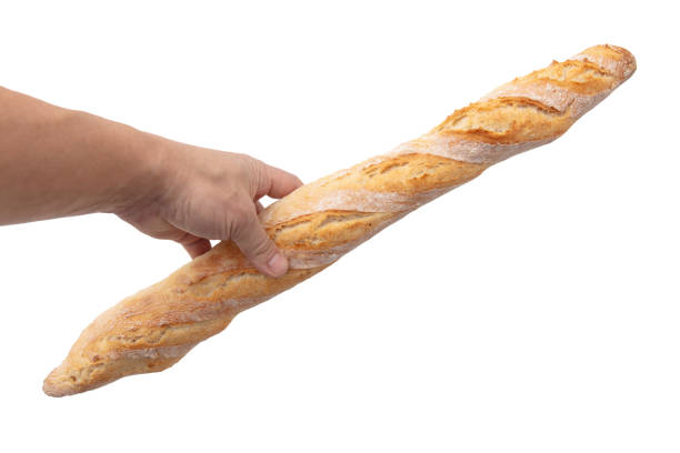 Baguette bread in hand isolated on white background.