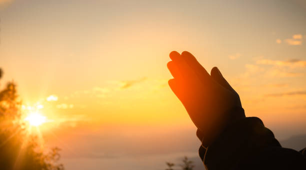 istock Christians pray or worship, human hands open palm up worship. Eucharist therapy bless god helping repent catholic easter lent mind pray. Christian religion concept background. person prayer, worshiper 2072676513