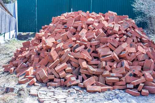 Pile of construction new red bricks for construction
