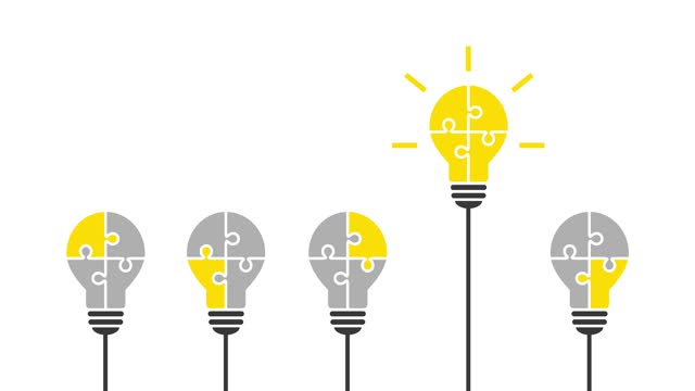 New idea, solution or innovation concept with yellow light bulb made of puzzle standing out from the rest
