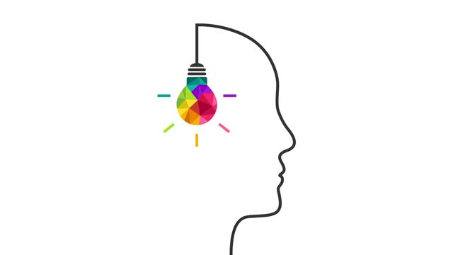 Colorful light bulb with head silhouette as creative idea and thinking concept