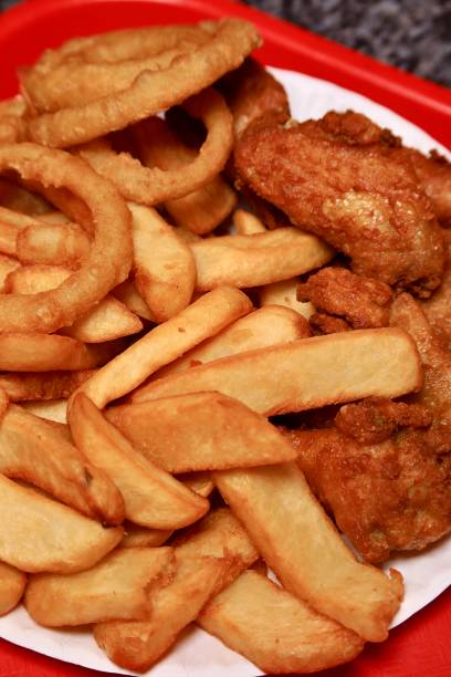 istock Chicken win dinner with fries, onion rings and side salad 2072754246