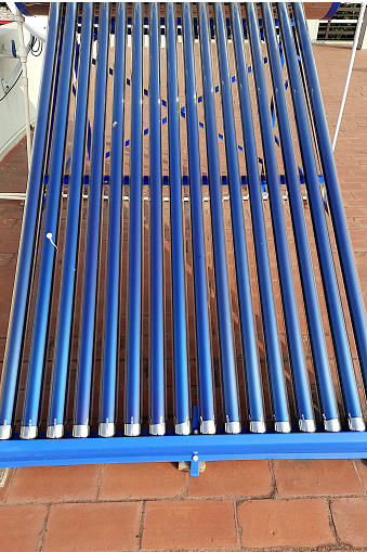 Close view of blue colour, tubular water heater panel on structural support