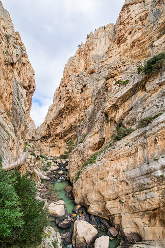 Amazing views along El Caminito del Rey, a long walkway hanging over 100 metres up on a sheer cliff face in a narrow gorge that runs through cliffs, canyons, and a large valley