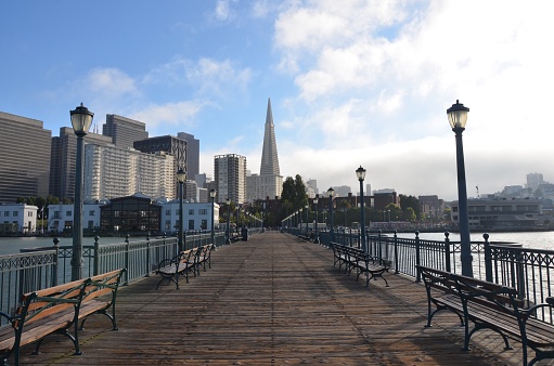A city view of San Francisco from the pier with Transamerica pyramid building in the middle