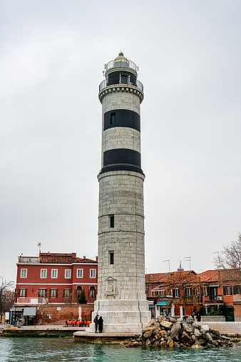 Murano, Italy- Feb 25,2023: The lighthouse on the island of Murano near Venice Italy