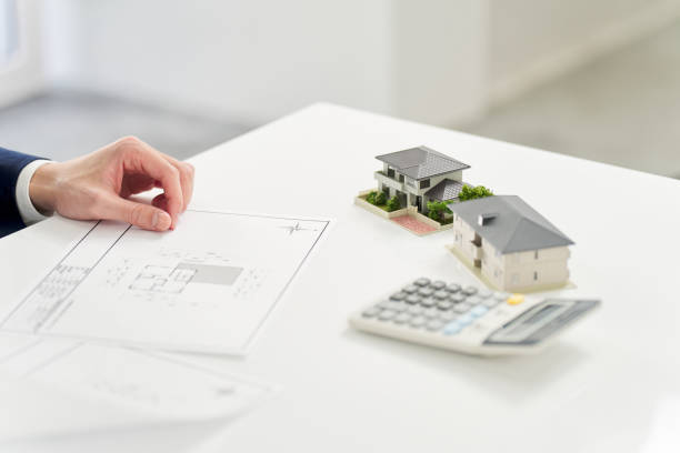 istock Businessman thinking about real estate floor plan 2072790872