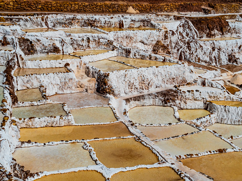 Maras Salt Mines, also known as Salineras de Maras, consist of over 3000 ponds all connected through an impressive underground network of canals that fill these pools with salt water